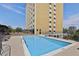 Relaxing swimming pool alongside a tall building with cityscape views at 2285 Peachtree Ne Rd # 1207, Atlanta, GA 30309