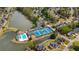 Community amenities viewed from above, featuring lakefront pool and tennis courts at 3270 River Summit Trl, Duluth, GA 30097