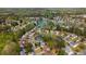 Expansive aerial view of a neighborhood with lush green trees and a beautiful lake at 3270 River Summit Trl, Duluth, GA 30097