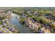 Birds eye view of neighborhood and lake featuring community amenities in a wooded setting at 3270 River Summit Trl, Duluth, GA 30097