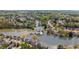 Gorgeous aerial shot of the neighborhood featuring a lake, pool, and tennis courts at 3270 River Summit Trl, Duluth, GA 30097