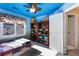 Bedroom with blue ceiling and walls, features a window and a door to another room at 3270 River Summit Trl, Duluth, GA 30097