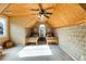 Bedroom featuring wood design walls and a ceiling fan, two wooden beds, and window at 3270 River Summit Trl, Duluth, GA 30097