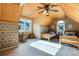 Bedroom featuring wood design walls and a ceiling fan, two wooden beds, and window at 3270 River Summit Trl, Duluth, GA 30097