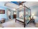 Primary bedroom featuring high tray ceilings, ceiling fan, and comfortable bedding at 3270 River Summit Trl, Duluth, GA 30097