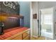 Coffee bar with wooden countertop, tile backsplash, storage cabinets, copper fixtures, and coffee maker at 3270 River Summit Trl, Duluth, GA 30097