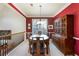 Formal dining room featuring an antique china cabinet and ample seating at 3270 River Summit Trl, Duluth, GA 30097