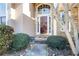 Close-up of a home's inviting entrance featuring a glass door and well-kept landscaping at 3270 River Summit Trl, Duluth, GA 30097