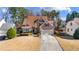 Traditional two-story home with a well-manicured lawn and attached garage at 3270 River Summit Trl, Duluth, GA 30097