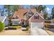 Attractive two-story home featuring a two-car garage and manicured landscaping at 3270 River Summit Trl, Duluth, GA 30097