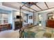 Luxurious primary bedroom with a cozy fireplace, tray ceilings, and a nearby ensuite bathroom at 3270 River Summit Trl, Duluth, GA 30097