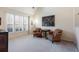 Bright sitting area with large windows and comfortable armchairs at 3270 River Summit Trl, Duluth, GA 30097