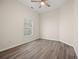 Bedroom with wood-look flooring and a bright window at 556 James P Brawley Nw Dr, Atlanta, GA 30318