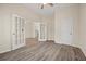 Bright bedroom featuring stylish doors, wood floors, and ample space, creating an ideal environment for comfort and style at 556 James P Brawley Nw Dr, Atlanta, GA 30318
