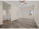Bedroom with ensuite bathroom, featuring a ceiling fan, and wood-look floors at 556 James P Brawley Nw Dr, Atlanta, GA 30318