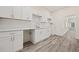 Modern kitchen with white cabinets, countertops, and subway tile backsplash, providing a clean and stylish culinary space at 556 James P Brawley Nw Dr, Atlanta, GA 30318