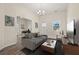 Inviting living room with high ceilings, stylish wood flooring, and modern decor, creating a cozy and elegant atmosphere at 556 James P Brawley Nw Dr, Atlanta, GA 30318