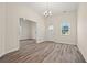 Bright living space with high ceilings, wood floors, natural light, and neutral tones, ideal for relaxing or entertaining guests at 556 James P Brawley Nw Dr, Atlanta, GA 30318