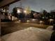 Back patio boasts a concrete slab and inviting outdoor lighting perfect for entertaining guests at 211 Orchard Trl, Canton, GA 30115