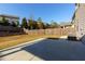 Spacious backyard featuring a concrete patio and a well-maintained lawn with landscaping at 211 Orchard Trl, Canton, GA 30115