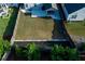 A spacious, level backyard featuring fresh sod and a stone retaining wall for enhanced outdoor enjoyment at 211 Orchard Trl, Canton, GA 30115