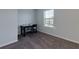 Simple bedroom with a desk, chair, and window providing natural light, perfect for a home office or guest room at 211 Orchard Trl, Canton, GA 30115