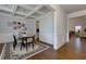 Formal dining area with hardwood floors, decorative molding, and a clear view to the connecting rooms at 211 Orchard Trl, Canton, GA 30115
