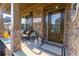 Inviting front porch featuring brick columns, a cozy seating area, and a decorative welcome sign at 211 Orchard Trl, Canton, GA 30115
