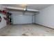 Spacious garage with ample storage space and an automatic door opener at 211 Orchard Trl, Canton, GA 30115
