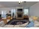Open living room featuring a stone fireplace and comfortable seating area at 211 Orchard Trl, Canton, GA 30115
