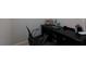 Small office space featuring a black desk and chair, perfect for a home workspace at 211 Orchard Trl, Canton, GA 30115