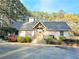 Community clubhouse with stone facade, exposed beams, and lush landscaping; perfect for gatherings at 35 Rumson Se Ct, Smyrna, GA 30080