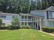 Inviting condominium complex featuring covered porches, landscaped grounds, and classic architectural details at 35 Rumson Se Ct, Smyrna, GA 30080