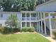 Charming condominium complex featuring covered porches, convenient stair access, and well-manicured landscaping at 35 Rumson Se Ct, Smyrna, GA 30080