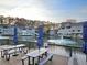 Scenic lake view from the deck with tables and umbrellas at 35 Rumson Se Ct, Smyrna, GA 30080