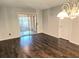 Elegant living room with hardwood floors and a view of the enclosed porch at 35 Rumson Se Ct, Smyrna, GA 30080