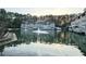 Scenic view of condos overlooking a tranquil pond with fountain feature at 35 Rumson Se Ct, Smyrna, GA 30080