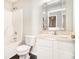 Bright bathroom features a shower-tub combo, wood-look flooring, and vanity with sink at 498 Pecan Wood Cir, Fairburn, GA 30213