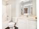 Cozy bathroom featuring a shower-tub combo, toilet, and a vanity with a large mirror at 498 Pecan Wood Cir, Fairburn, GA 30213