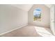 Bright bedroom with a large arched window providing natural light and neighborhood views at 498 Pecan Wood Cir, Fairburn, GA 30213