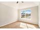Bedroom with large window for lots of light and carpeted floor at 498 Pecan Wood Cir, Fairburn, GA 30213