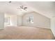Spacious bedroom features a large window and carpeted floors at 498 Pecan Wood Cir, Fairburn, GA 30213