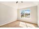 Well-lit bedroom with a large window overlooking the neighborhood at 498 Pecan Wood Cir, Fairburn, GA 30213