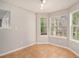 Bright dining area with tile flooring, large windows, and natural light at 498 Pecan Wood Cir, Fairburn, GA 30213