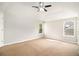 Bright main bedroom with high vaulted ceiling and natural light from two windows at 498 Pecan Wood Cir, Fairburn, GA 30213