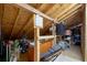 Unfinished attic featuring exposed wood and rafters, shelving, and plenty of storage space at 57 Cedarcrest Village Ln, Acworth, GA 30101
