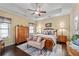 Comfortable main bedroom featuring hardwood flooring, neutral colors, a ceiling fan, and plenty of natural light at 57 Cedarcrest Village Ln, Acworth, GA 30101