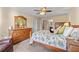 Bedroom featuring hardwood furniture, neutral carpeting, a ceiling fan, and natural light at 57 Cedarcrest Village Ln, Acworth, GA 30101