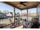 Comfortable covered porch with neighborhood view and ceiling fan, creating a relaxing outdoor ambiance at 57 Cedarcrest Village Ln, Acworth, GA 30101