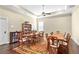 Spacious dining room with multiple tables, chairs, ceiling fan, and hardwood floors, great for large gatherings at 57 Cedarcrest Village Ln, Acworth, GA 30101
